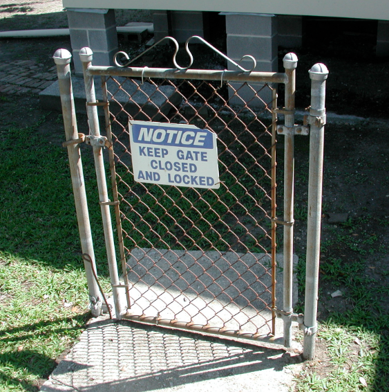 A gate with no fence that says, 'Keep gate closed and locked'